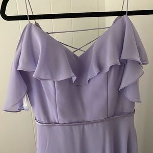 Lilac purple long bridesmaids dress with ruffle details and sleeves